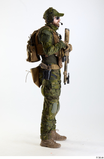 Andrew Elliott TS Pose with Machine Gun holding gun standing…